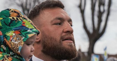 Conor McGregor holds son Rían during his first St Patrick's Day while declaring 'The world is yours'