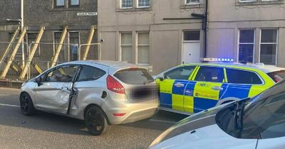 Maniac driver hunted after police chase and three-car crash in Scots village