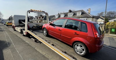 Uninsured driver with 'unrestrained' child in car charged as cops seize motor