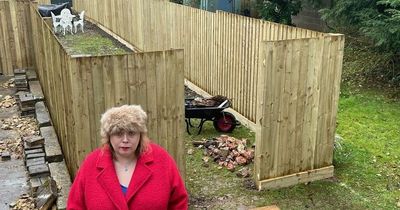 Neighbours fume as 'horrendous' fence put up by fellow resident in her part of garden