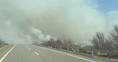 Driver trapped by wildfire near A830 as car becomes engulfed in smoke