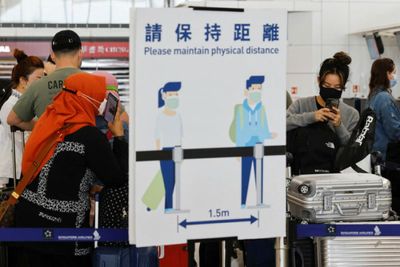 Hong Kong hopes to 'resolve' Covid flight-ban rule as cases ease