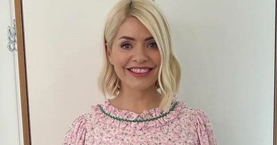 Holly Willoughby looks pretty in pink as she returns to This Morning after Covid