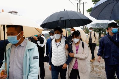 At China plane crash site, relatives wait in grim vigil