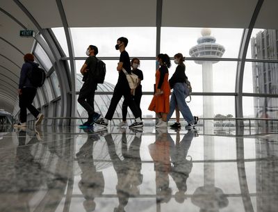 Singapore to waive quarantine for vaccinated travelers from April