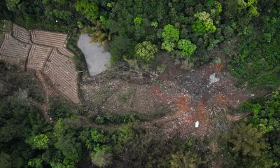 China plane crash: cockpit voice recorder analysed for clues as first victims found