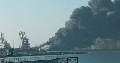 Russian navy ship destroyed in fire and smoke near besieged Ukraine city