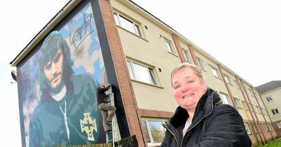 George Best mural in Belfast estate nears completion as sister visits site