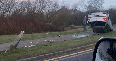 Car flips onto roof and lands on pavement as Scots driver rushed to hospital