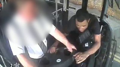 Passenger grabs bus wheel before running off into rush hour traffic