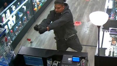 VIDEO: Desperate Robber Shoots Door 30 Times To Escape From Smoke Shop After He Was Locked Inside