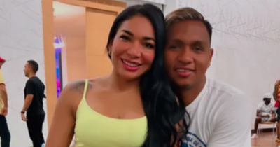 Rangers star Morelos and wife Yesenia cosy up as they return to Colombia