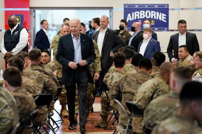 Biden eats pizza with troops in Poland and recalls how son Beau hid his name on front lines