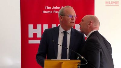 Security alert that forced Simon Coveney from stage at peace event condemned