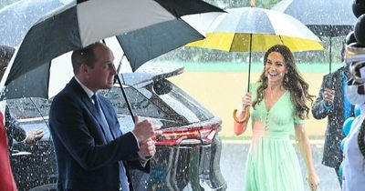 Prince William and Kate Middleton rained on as they arrive at a school in the Bahamas