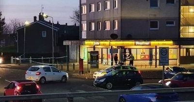 Police cordon off East Kilbride shop after man found injured in ongoing incident