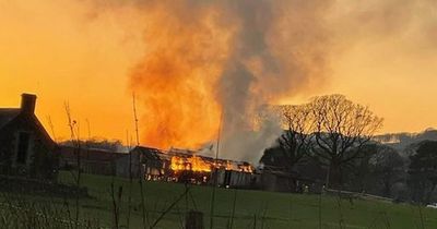 Dramatic pictures show barn engulfed in flames amid ongoing incident in quiet Scots village