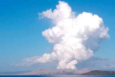 Philippine volcano near capital spews ash and gas