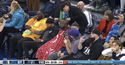 Fan gets haircut while sitting in the crowd during Minnesota Timberwolves NBA game