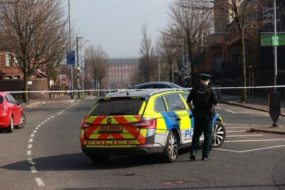 Woman held and suspected gun seized by police probing Belfast security alert