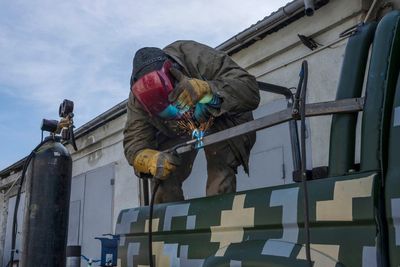 Ukrainian welders turn donated vehicles into army transport