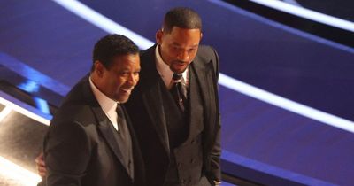 Will Smith consoled by Denzel Washington and Bradley Cooper after Chris Rock outburst