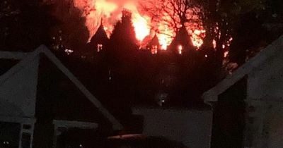 Flames leap through the roof of historic Hendrefoilan House in Swansea