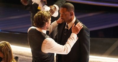 Will Smith 'calmed down' by Bradley Cooper after storming stage before picking up Oscar with emotional speech