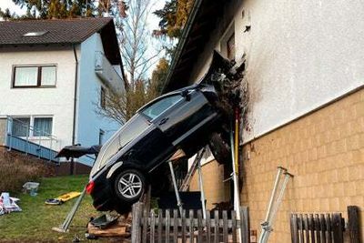 Car smashes into home in Germany killing driver and sending rubble flying across home