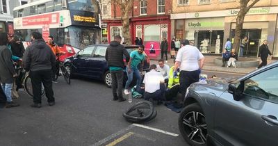 Emergency services rush to scene as food delivery cyclist injured in two-car accident in Cork city