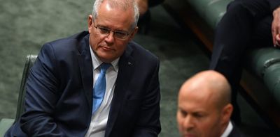 Cheaper petrol, cash handouts in Morrison government's vote-buying budget
