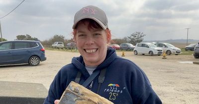 Woman 'buzzing' after discovering chest full of ancient coins while out litter-picking on a beach