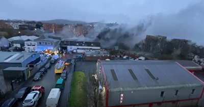 Edinburgh firefighters race to open blaze at single storey garage in ongoing incident