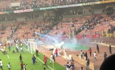 Furious Nigeria fans tear down dugouts and clash with police after World Cup play-off defeat