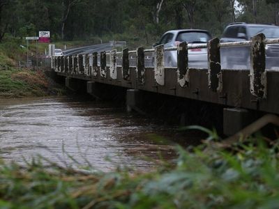 Five rescued in Qld floods as rain eases