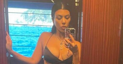Kourtney Kardashian shows off her incredible figure in cut-out swimsuit