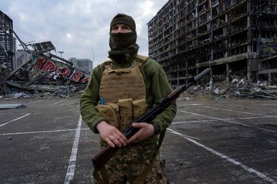 AP PHOTOS on Day 35: Scouring rubble of destroyed homes