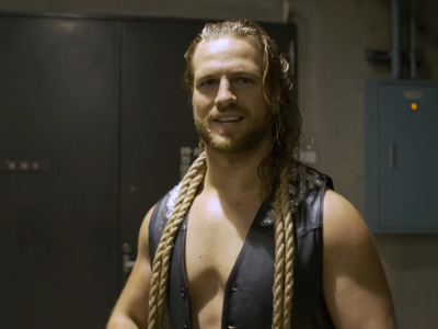 Bullish Sign? AEW Champion 'Hangman' Page Enters The Ring Driving Horned Tesla (Video)