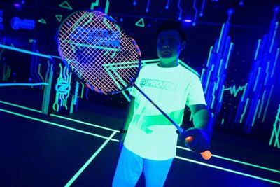 Glow-in-the-dark badminton entices Malaysian players back onto court