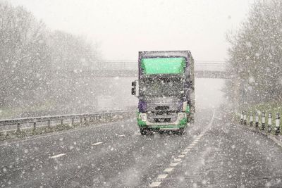 In Pictures: Snow falls during springtime cold snap