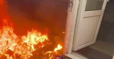 Moment heroic passer-by rescues shocked pensioner from burning house after jumping fence