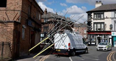 Scaffolding collapses outside disused pub on busy high street