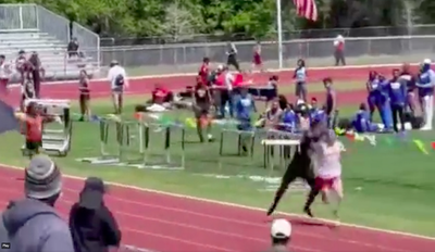 Athlete throws wild sucker punch after being told to move out of the way of runner during track race in Florida school