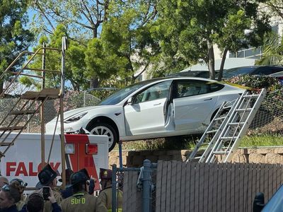 Tesla Model 3 Crashes Atop Parked Ambulance As Driver Mistakes Pedals