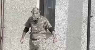 Terrifying footage shows Inverness knifeman in gas mask charge at cops with weapon