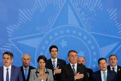 Brazil officials resign to seek new posts, boost Bolsonaro