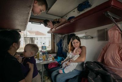 The people who keep the refugee trains running out of Ukraine – photo essay