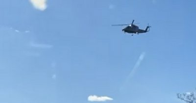 Amazed Edinburgh locals watch on as Queen's helicopter touches down at Holyrood