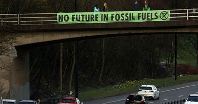 Extinction Rebellion stage rush hour Central Motorway protest in Newcastle