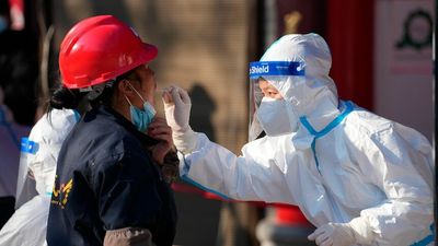 Inside the lives of frontline workers making China's COVID-zero strategy possible